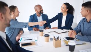 shaking-hands-business-people-smile-and-meeting-for-teamwork-collaboration-and-hiring-process-in-office-welcome-corporate-group-and-palm-connect-for-recruitment-or-interview-and-congratulations