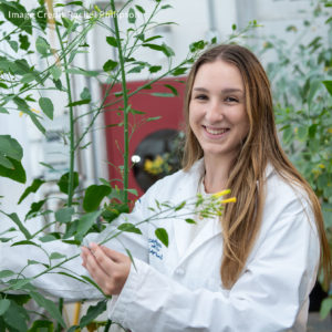 Caroline Artymowicz in the greenhouse
