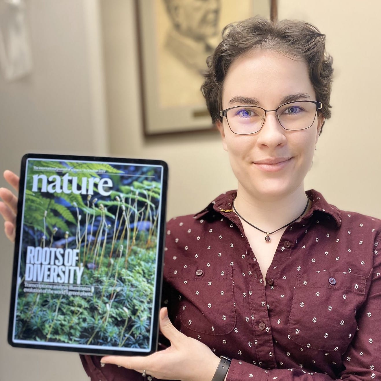 BTI graduate student Alaina Petlewski displays the October 31 issue of Nature, for which she took the cover photo.