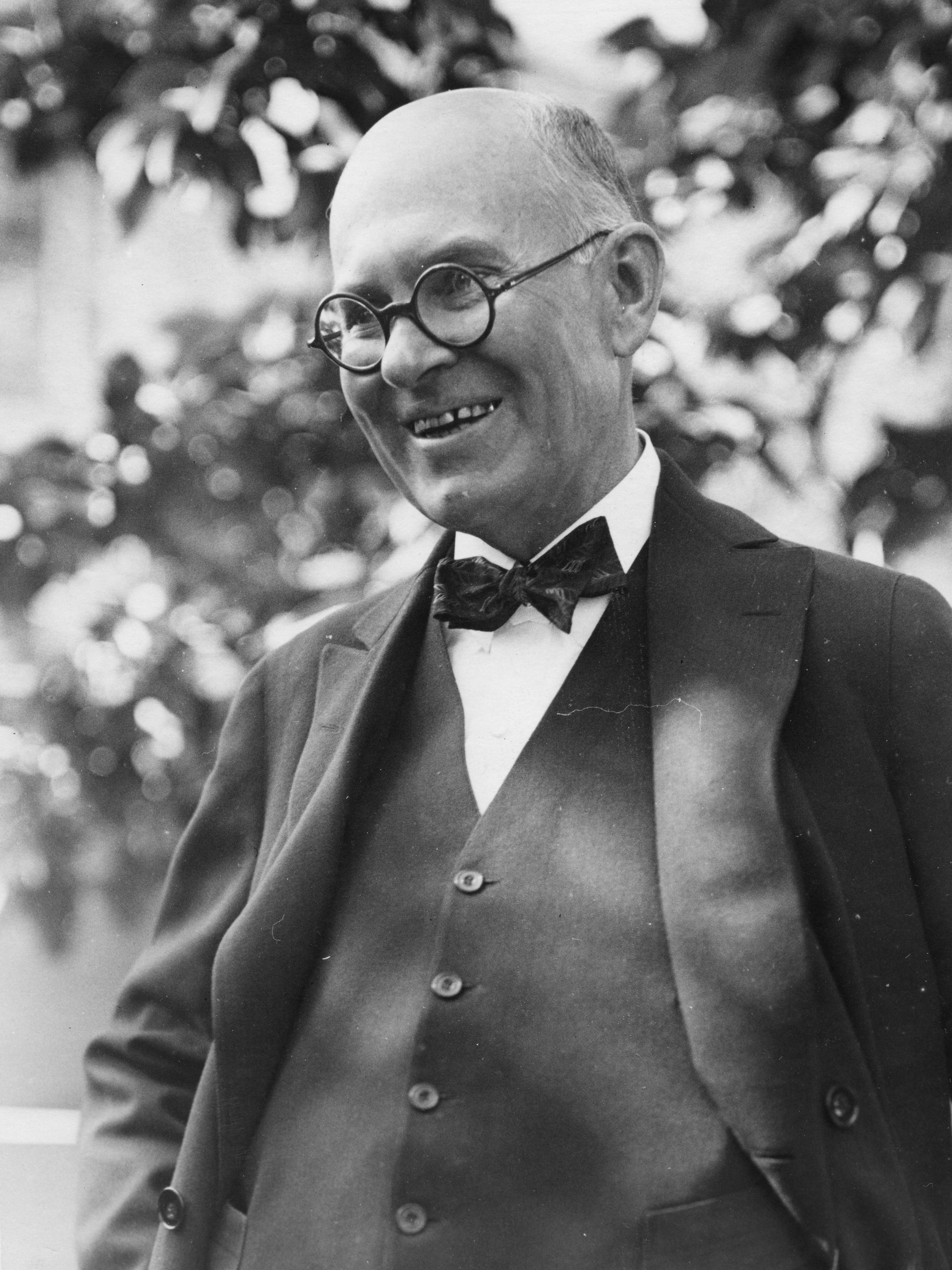 Black and white image of William Boyce Thompson smiling